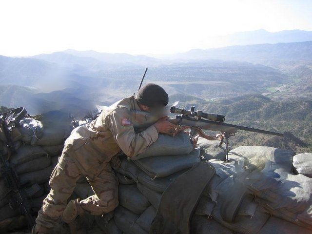 A soldier aiming with an M91A2 sniper rifle