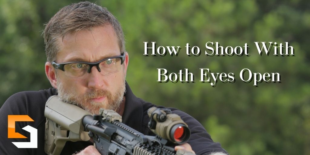 Chris shooting a rifle using both eyes. 
