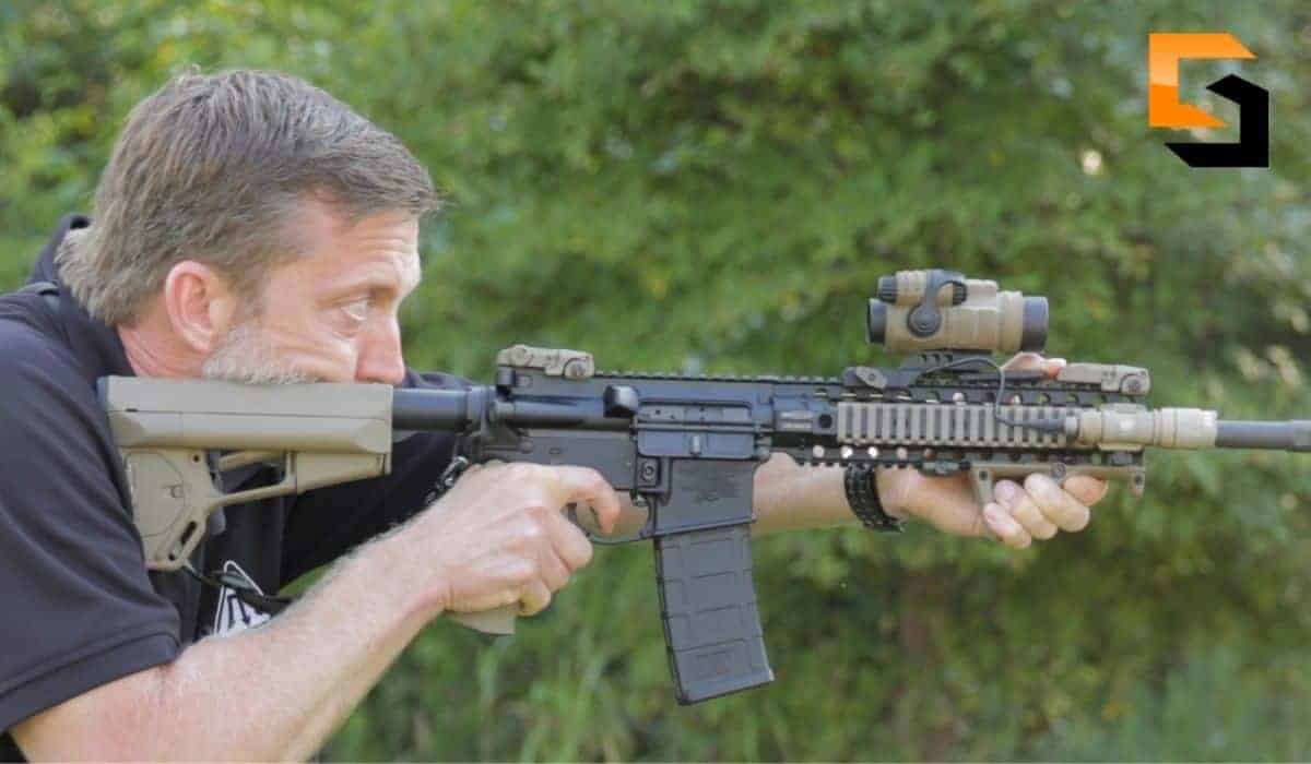 Chris Sajnog aiming using a rifle.